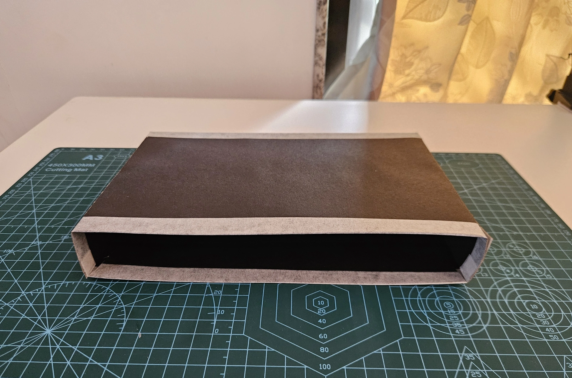The final slipcase lying on its side